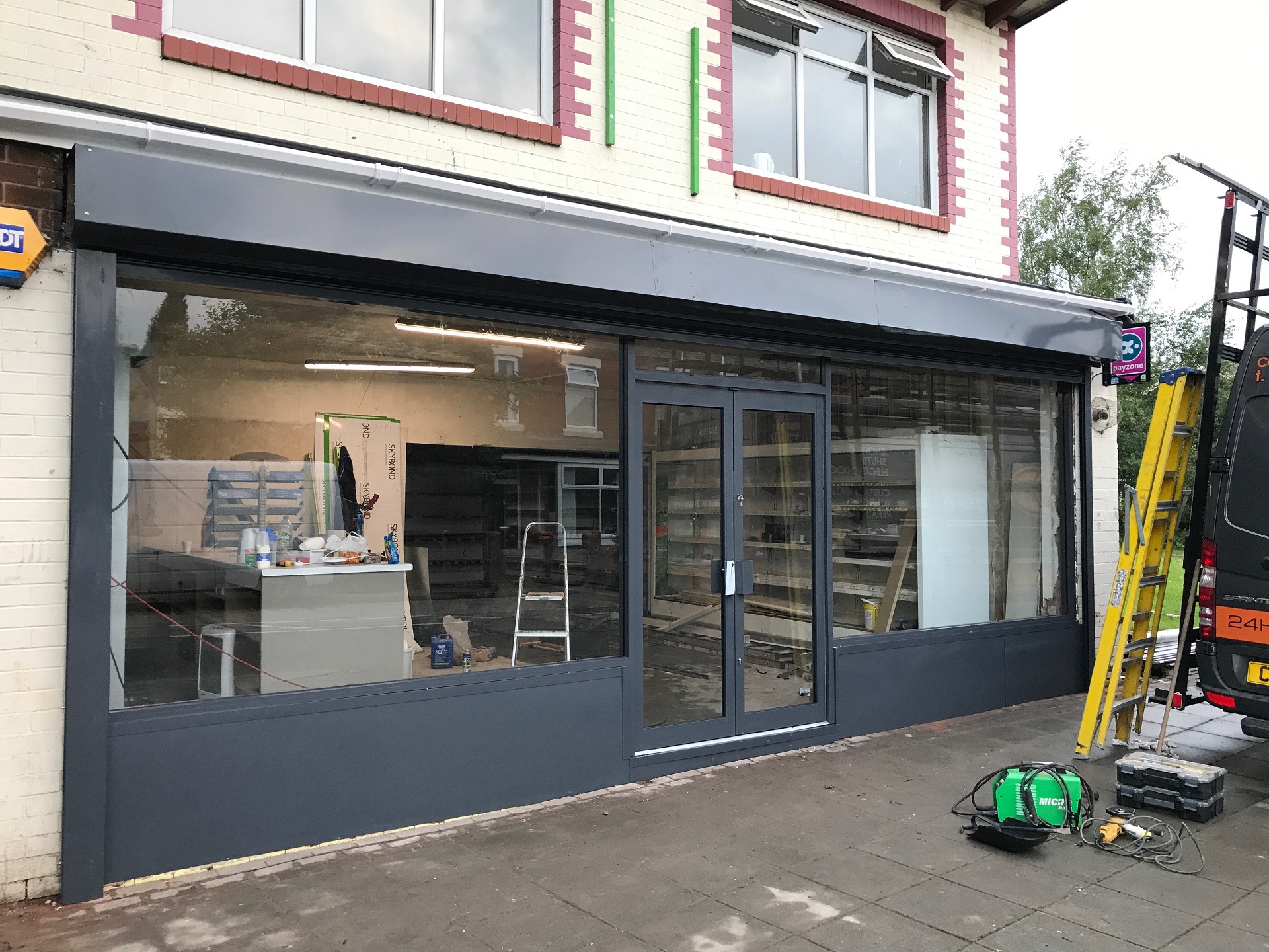 Shop door repair London - hinge and alignment